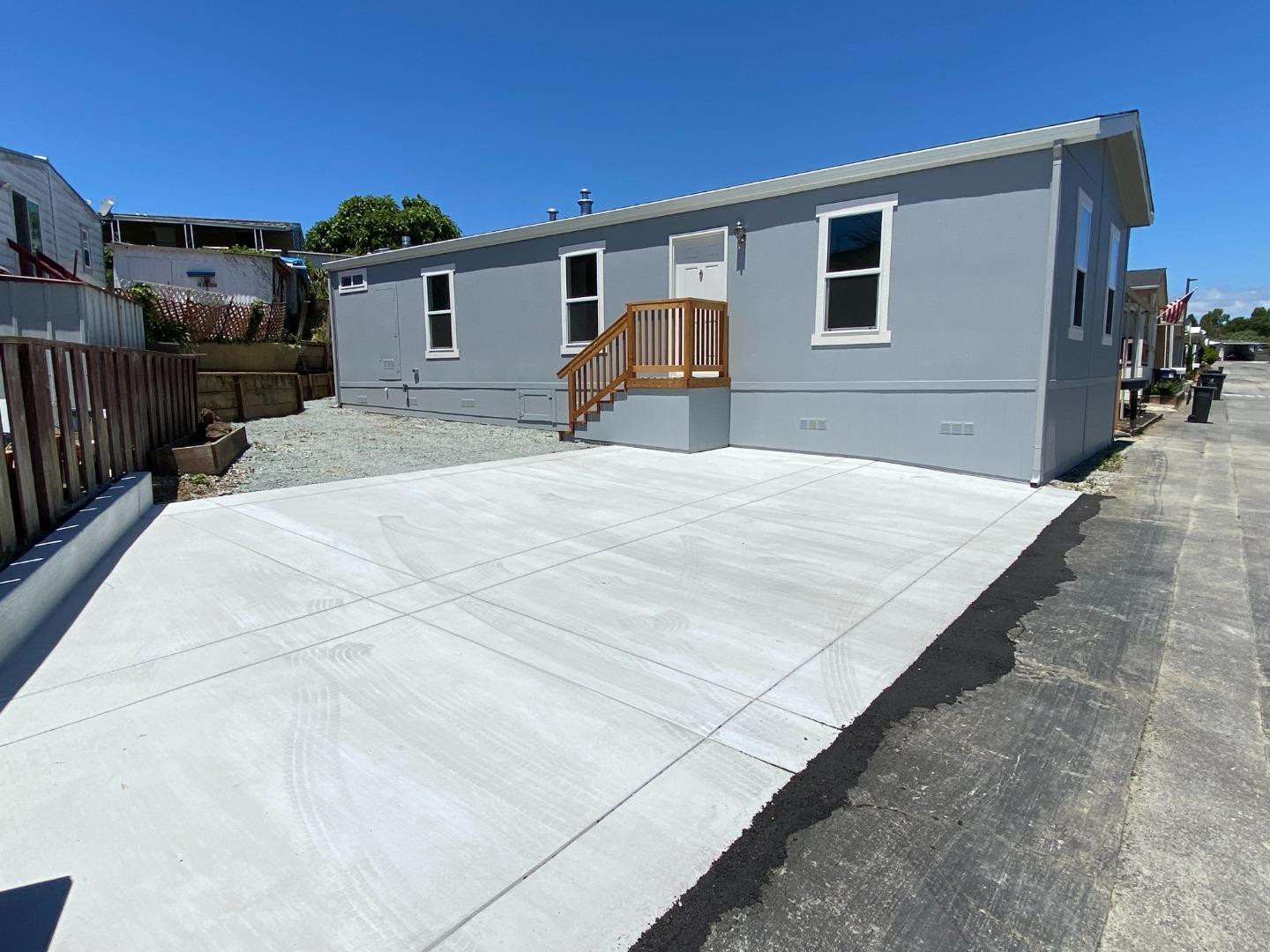 128 Pera Drive, Unit 128 Watsonville, CA 95076 - Photo 2 of 29 a house view with a backyard space