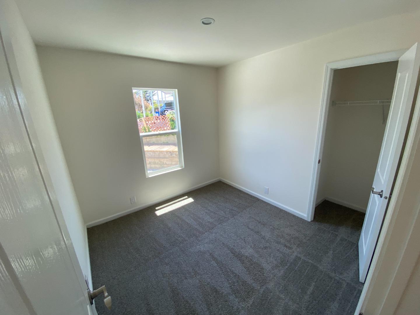 128 Pera Drive, Unit 128 Watsonville, CA 95076 - Photo 22 of 29 an empty room with windows