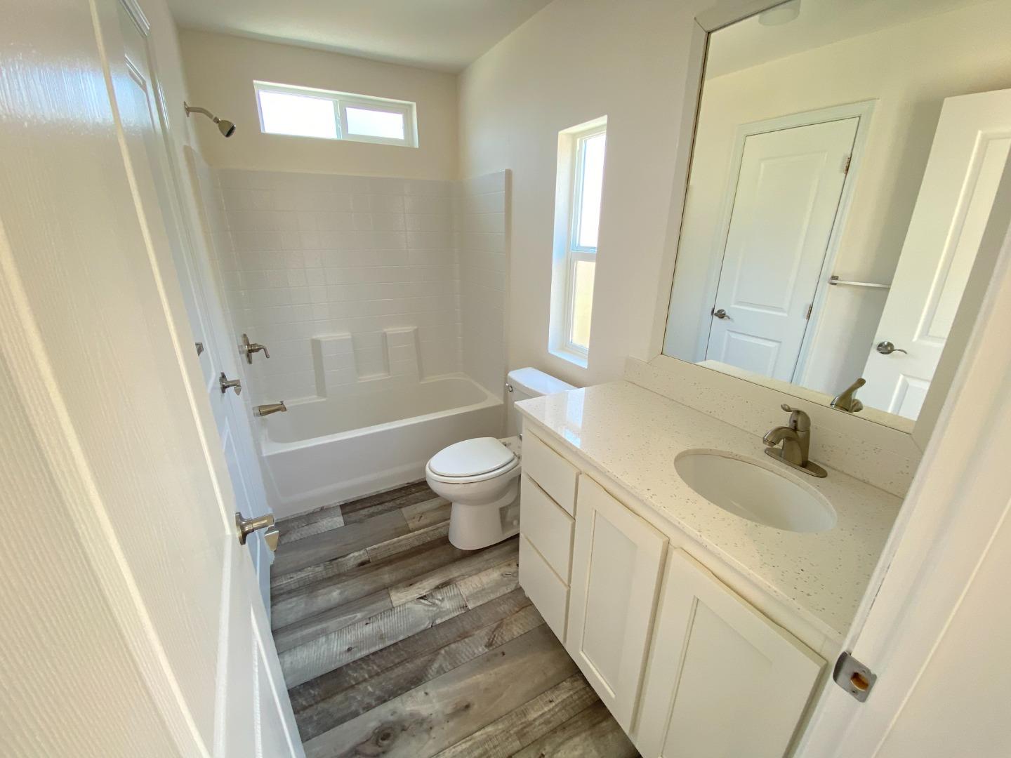 128 Pera Drive, Unit 128 Watsonville, CA 95076 - Photo 25 of 29 a bathroom with a sink and a mirror