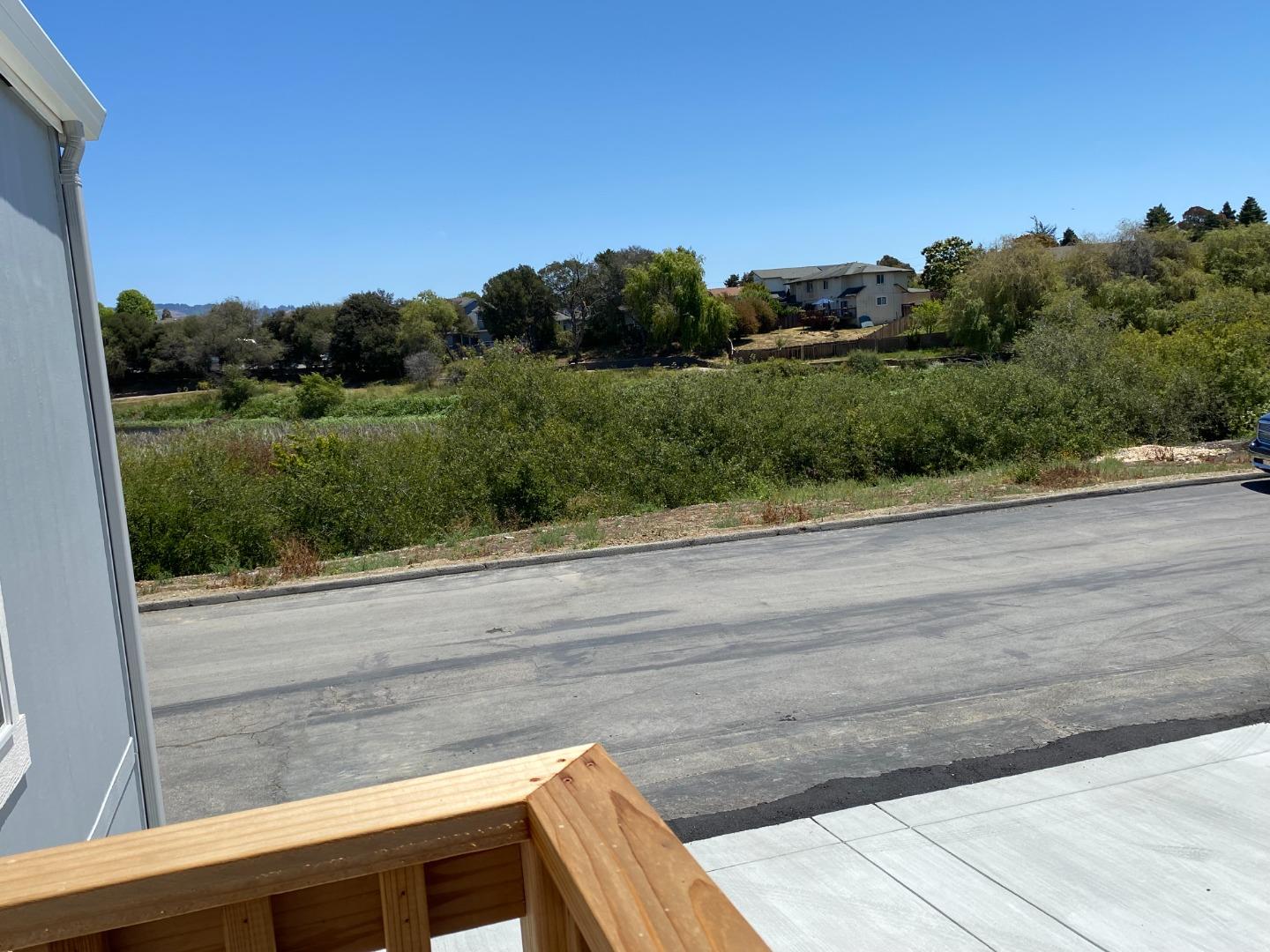 128 Pera Drive, Unit 128 Watsonville, CA 95076 - Photo 8 of 29 a view of a street with a yard