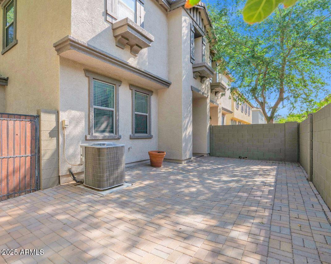 1265 South Aaron, Unit 351 Mesa, AZ 85209 - Photo 1 of 17 a view of a back yard of the house
