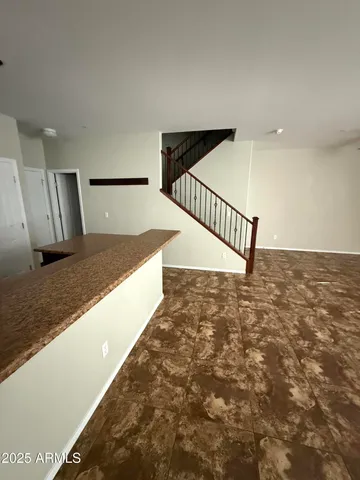 a view of a hallway with staircase