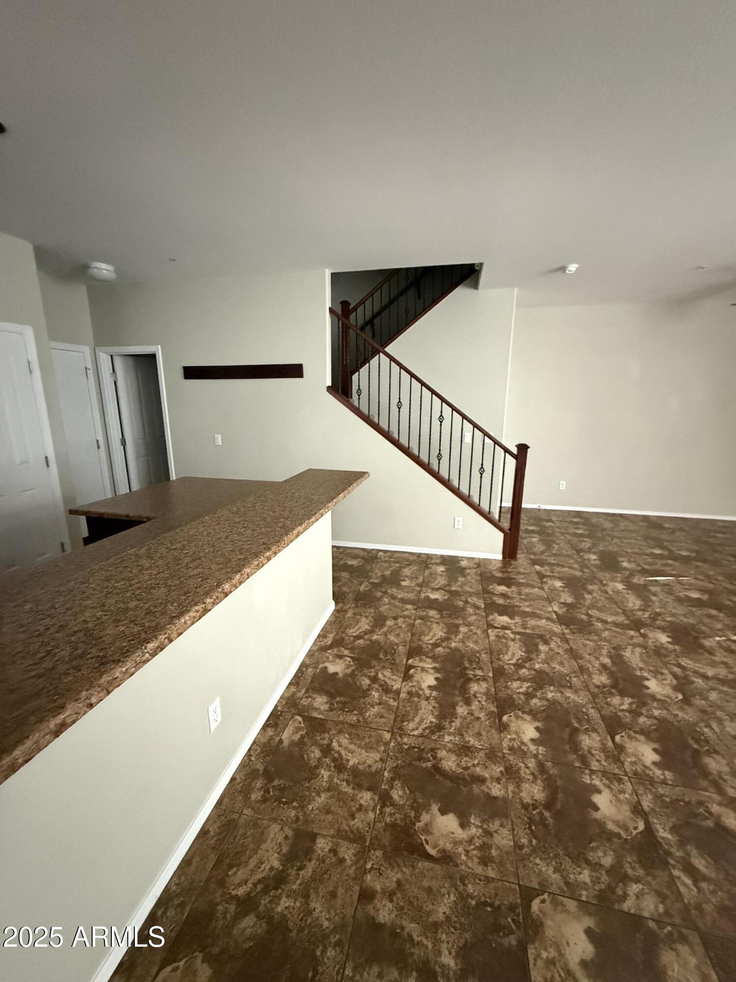 1265 South Aaron, Unit 351 Mesa, AZ 85209 - Photo 15 of 17 a view of a hallway with staircase