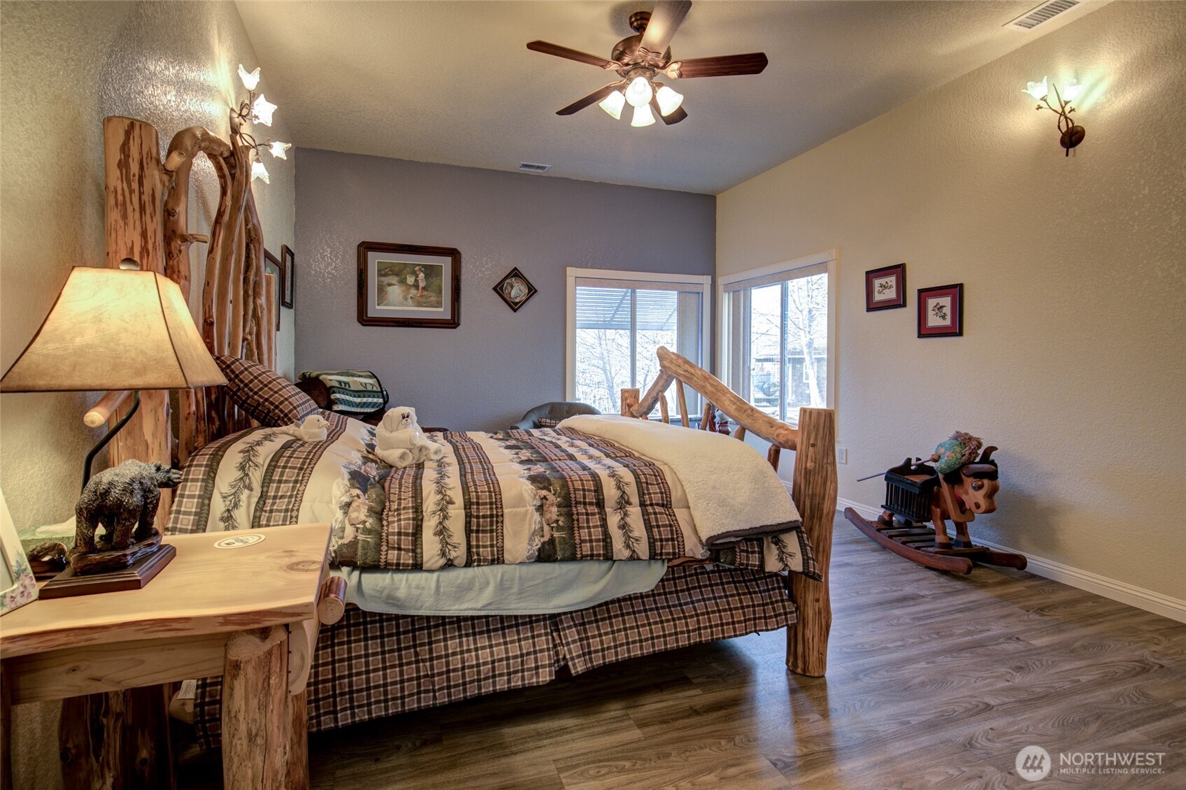 2695 State Route 109 Copalis Beach, WA 98535 - Photo 19 of 40 a bed room with a bed and a chandelier