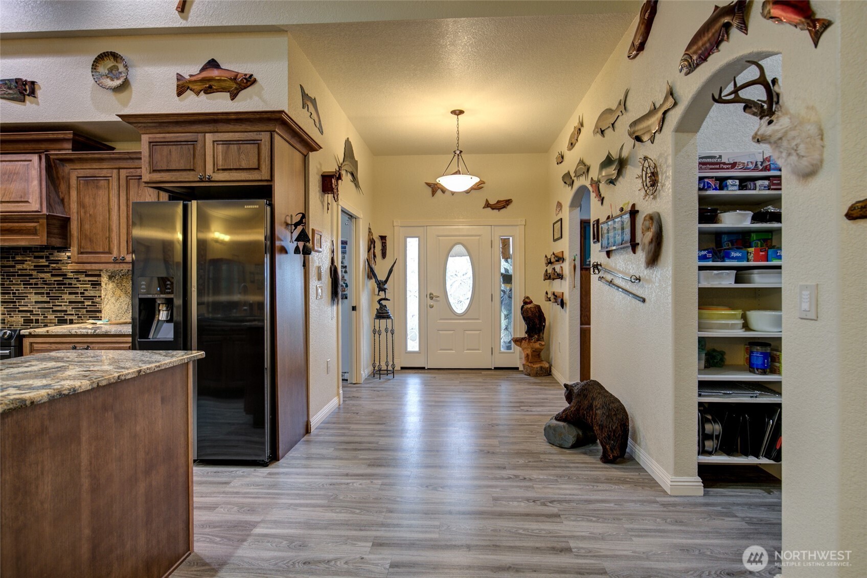 2695 State Route 109 Copalis Beach, WA 98535 - Photo 22 of 40 a view of a hallway with wooden floor and cabinets