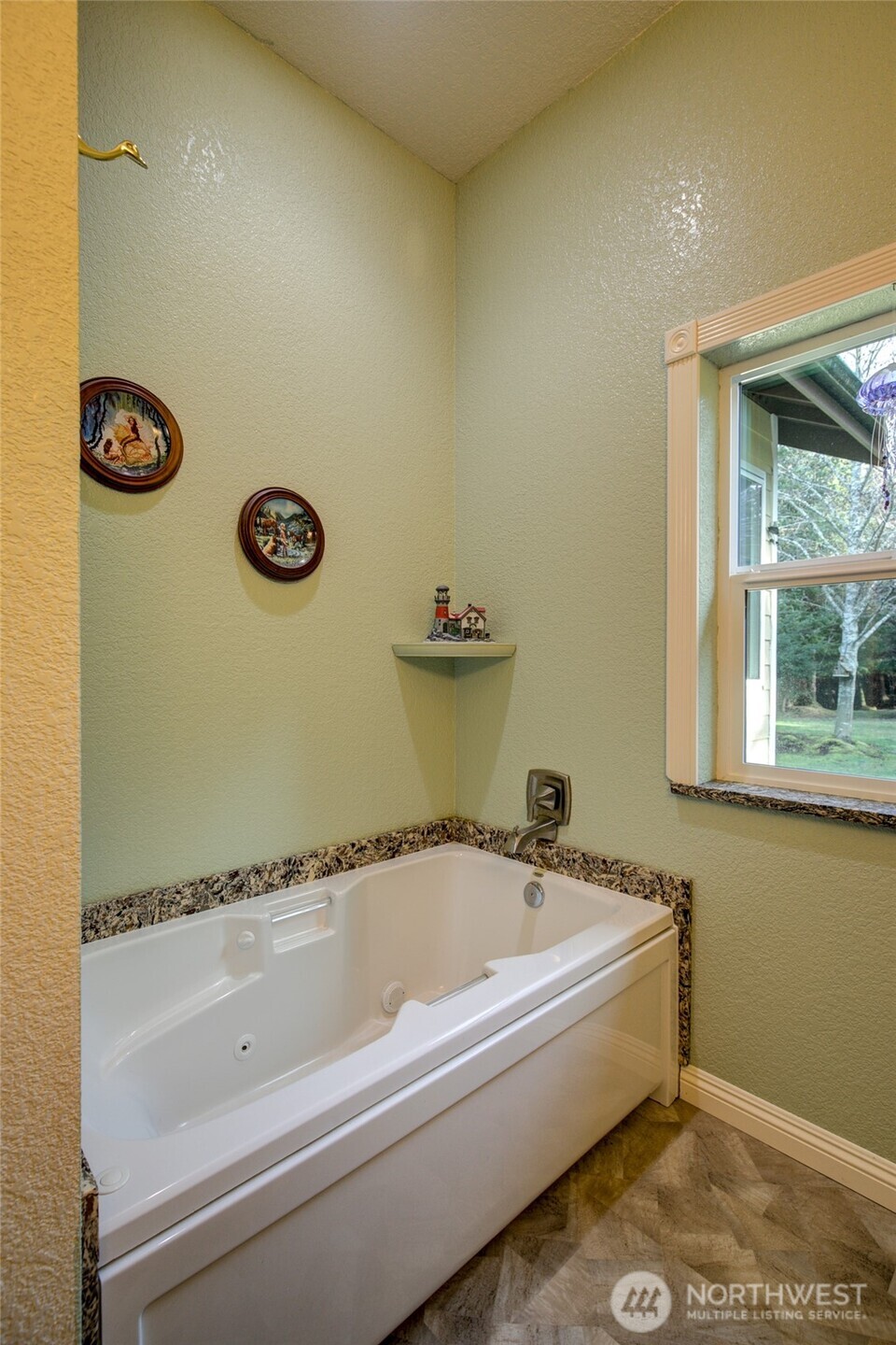 2695 State Route 109 Copalis Beach, WA 98535 - Photo 25 of 40 a bathroom with a tub and a window
