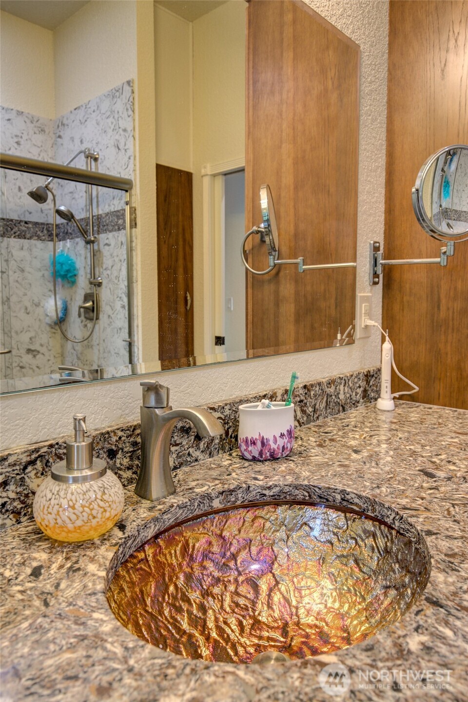 2695 State Route 109 Copalis Beach, WA 98535 - Photo 27 of 40 a bathroom with a granite countertop sink and a mirror
