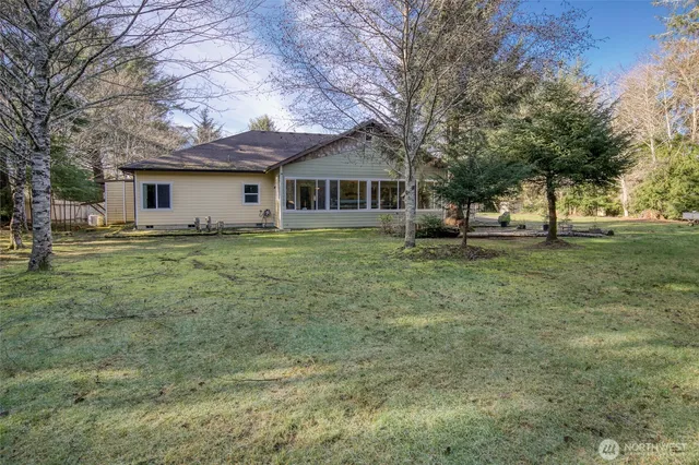 a house that has a tree in front of it