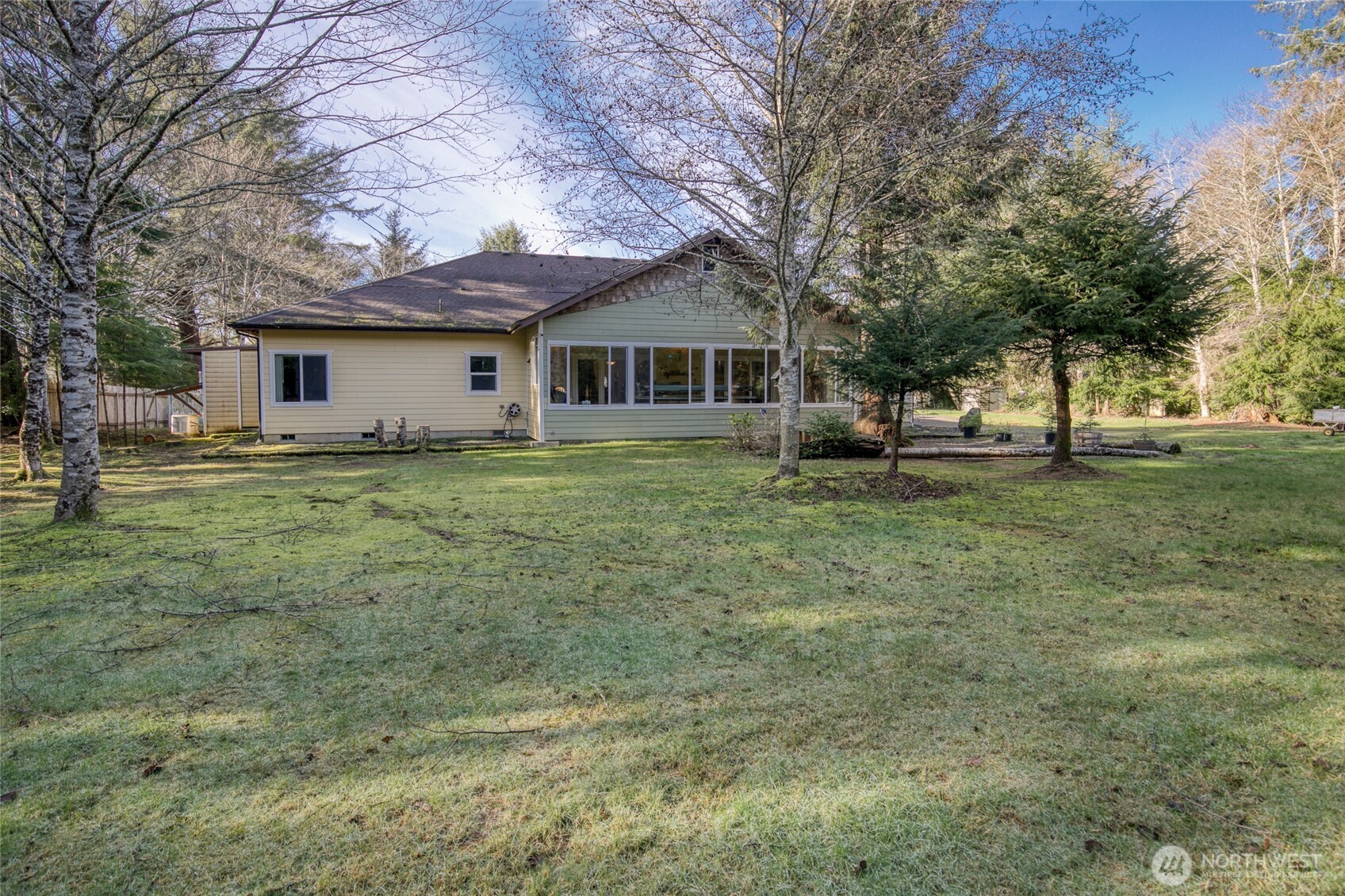 2695 State Route 109 Copalis Beach, WA 98535 - Photo 3 of 40 a house that has a tree in front of it
