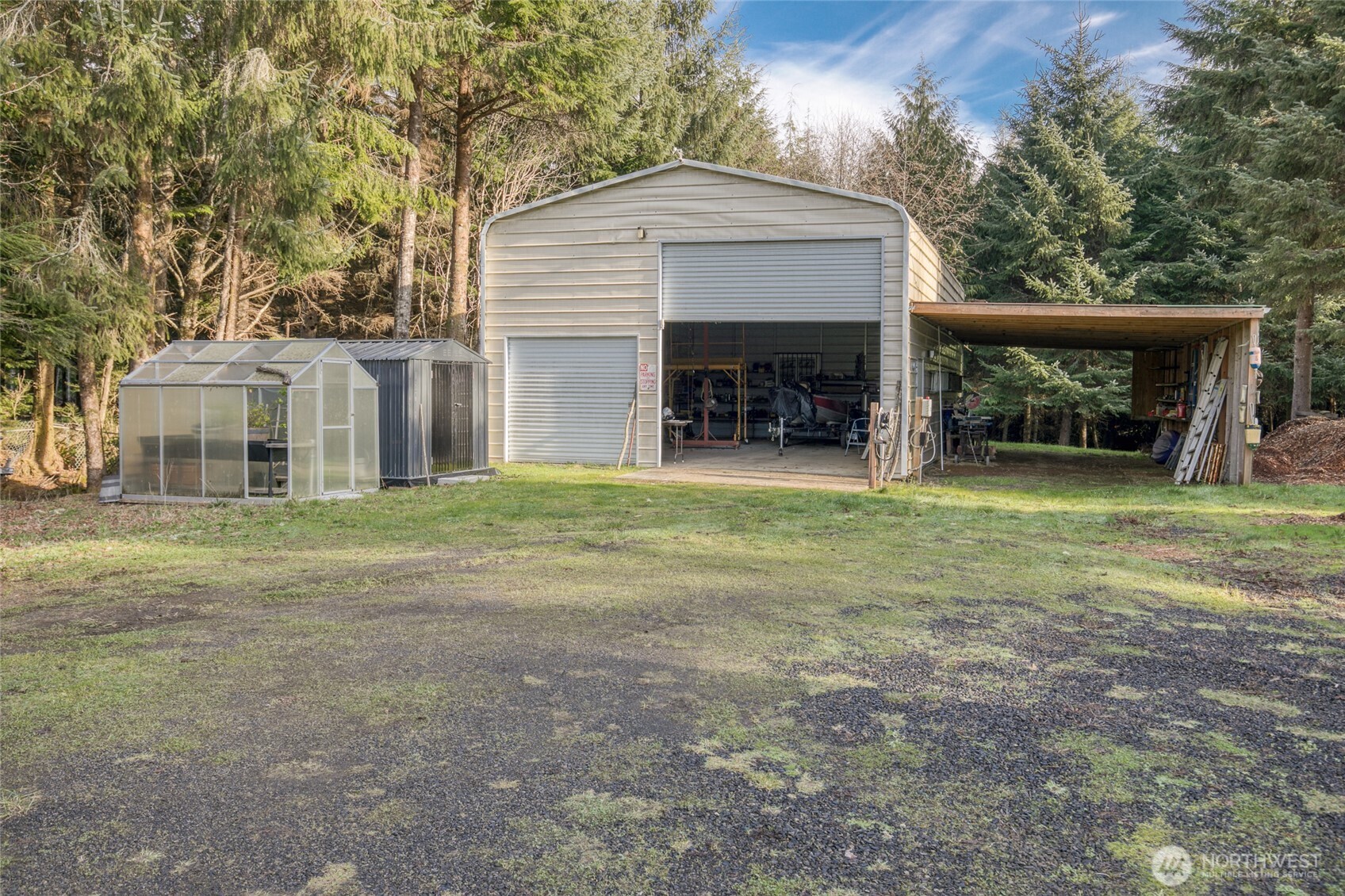 2695 State Route 109 Copalis Beach, WA 98535 - Photo 34 of 40 a view of a house with a yard and a garage
