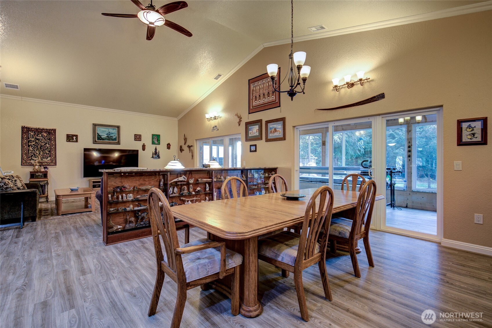 2695 State Route 109 Copalis Beach, WA 98535 - Photo 5 of 40 a view of a dining room with furniture a chandelier and wooden floor