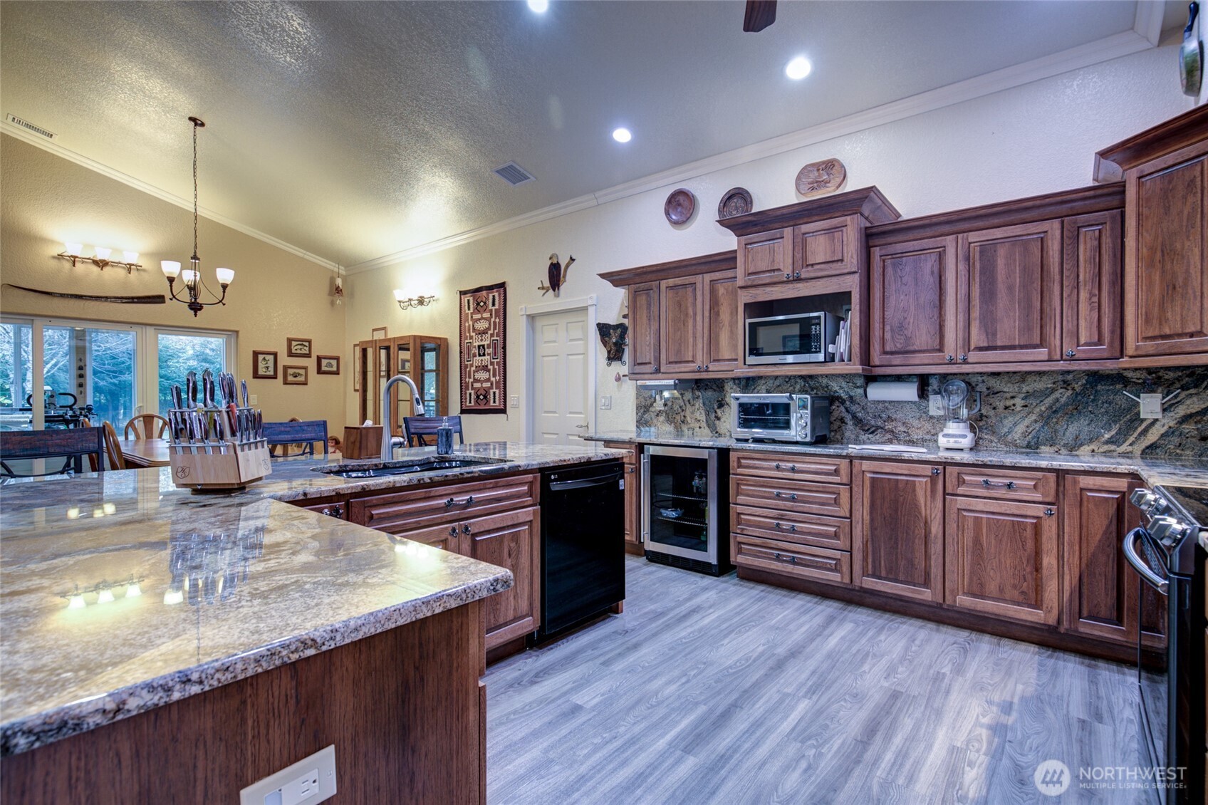 2695 State Route 109 Copalis Beach, WA 98535 - Photo 8 of 40 a kitchen with stainless steel appliances granite countertop wooden cabinets a stove top oven a sink and dishwasher