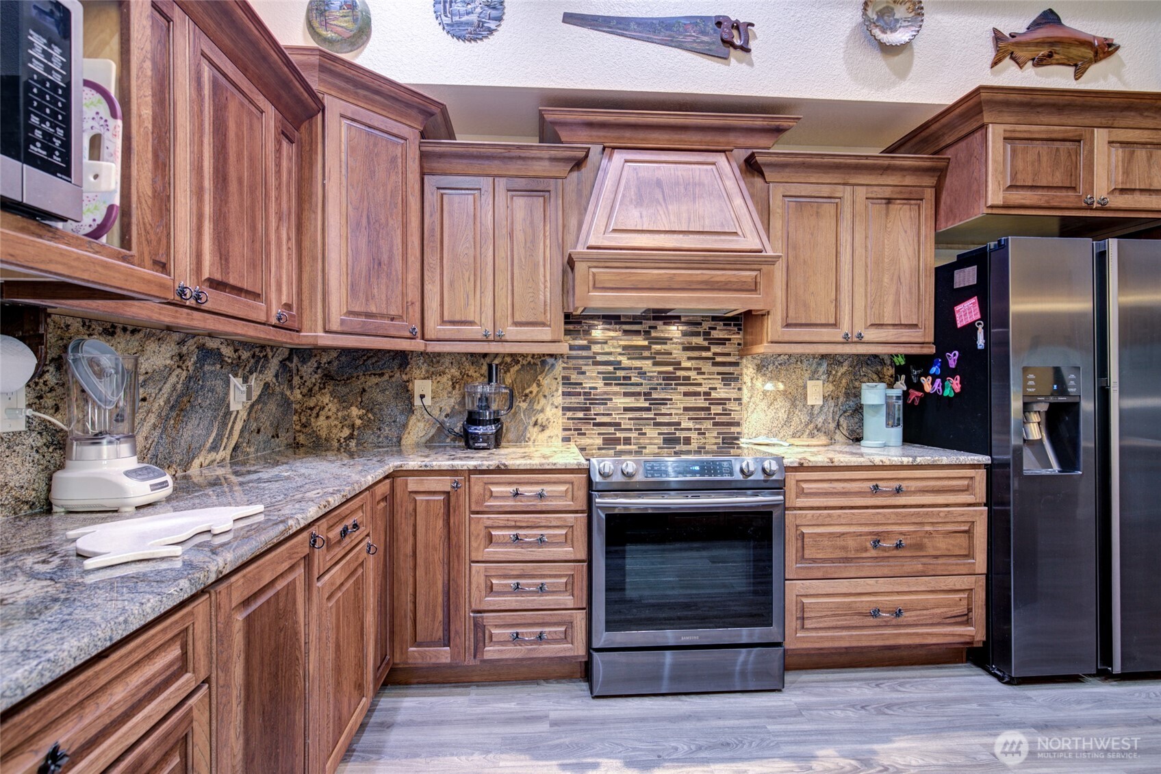 2695 State Route 109 Copalis Beach, WA 98535 - Photo 9 of 40 a kitchen with stainless steel appliances granite countertop a sink and cabinets