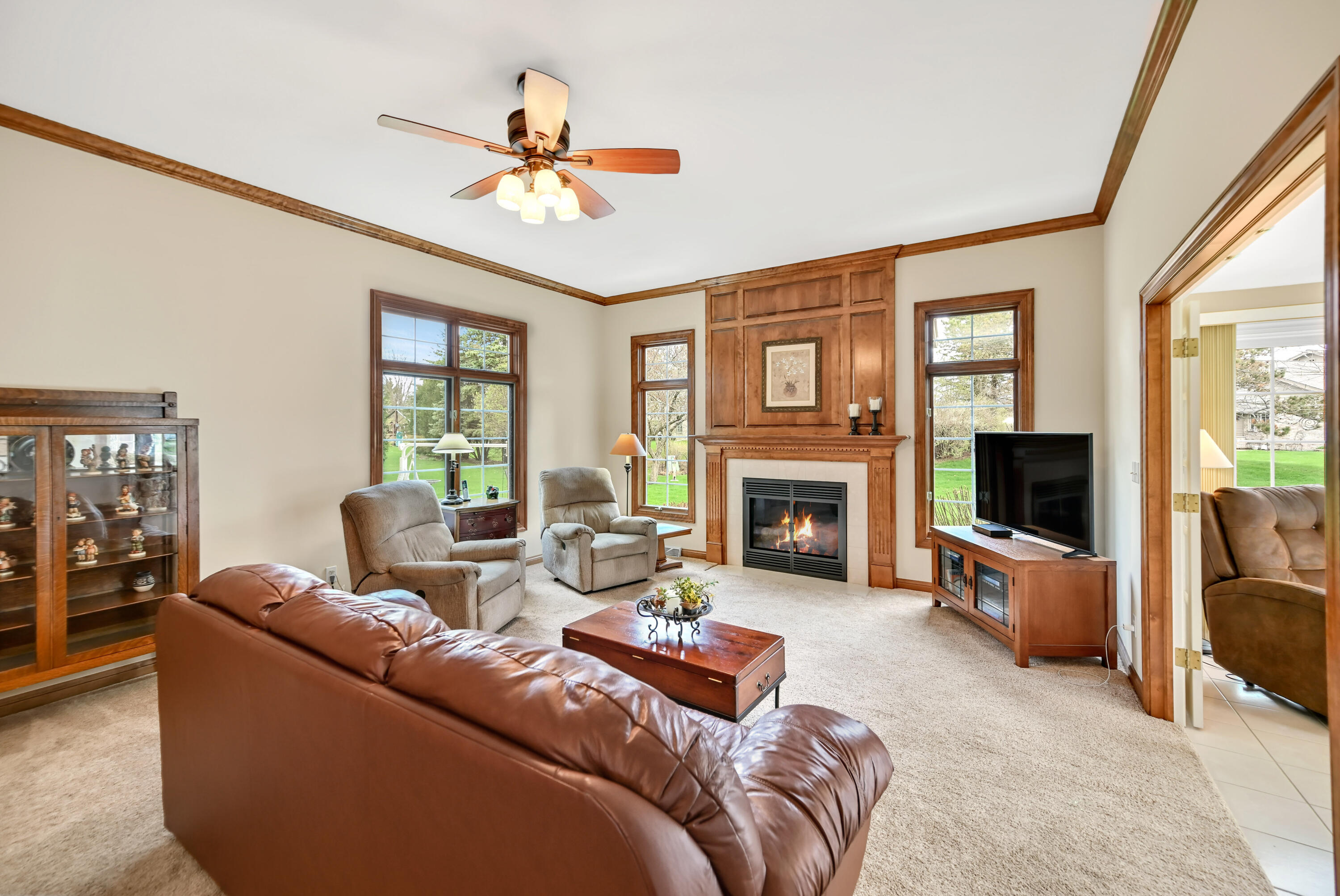 17700 Parish Drive Brookfield, WI 53045 - Photo 8 of 42 Relax around the gas fireplace