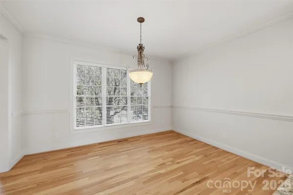 a kitchen with granite countertop white cabinets stainless steel appliances and sink