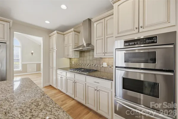 a bathroom with double sink and a mirror
