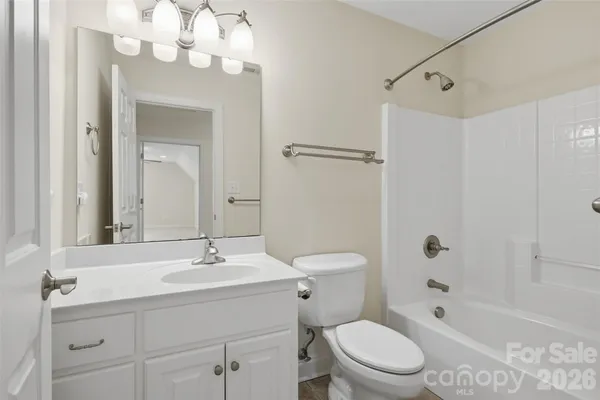 a view of a livingroom with an empty space and a window