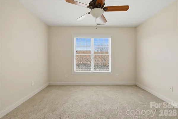 an aerial view of a house with outdoor space