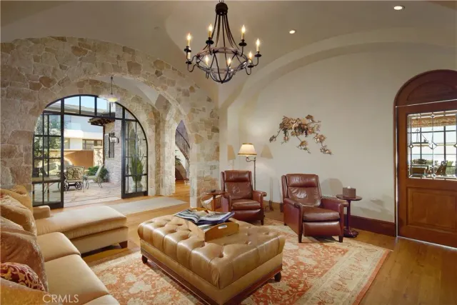 a view of a brick building with a table and chairs