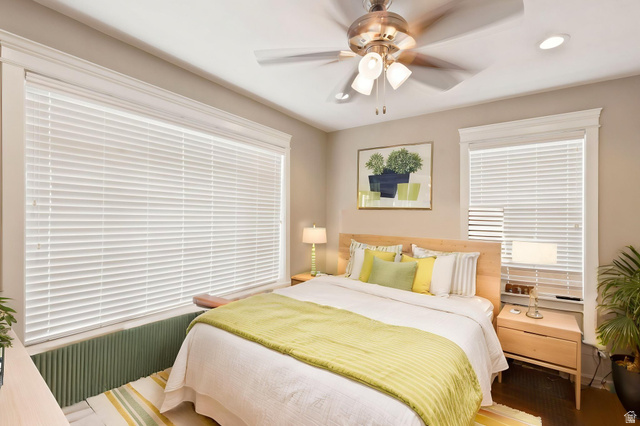 580 North 300 East Logan, UT 84321 - Photo 54 of 74 Recessed lighting, a ceiling fan with integrated lighting, and multiple windows with blinds provide ample illumination