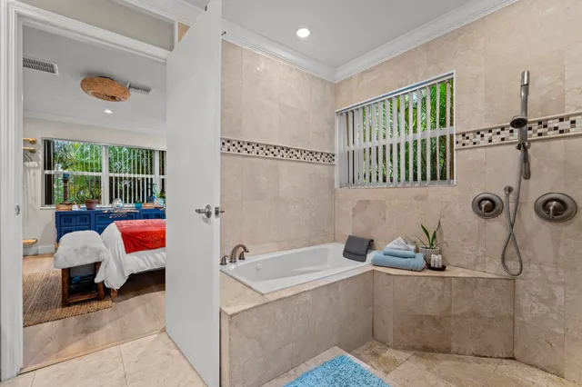 a bathroom with a tub and a shower