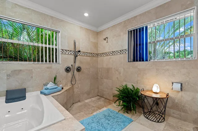 a bath room with a table and a potted plant