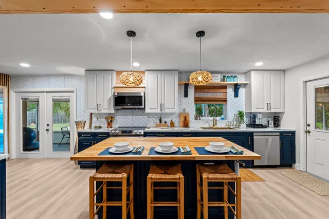 a kitchen with a table and chairs in it