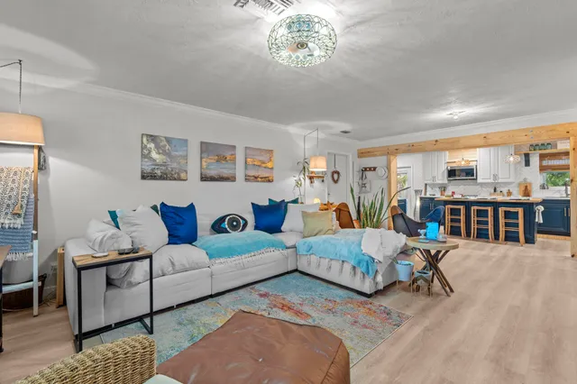 a living room with furniture and a table