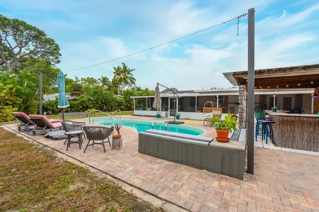 a view of a chairs and table in the patio