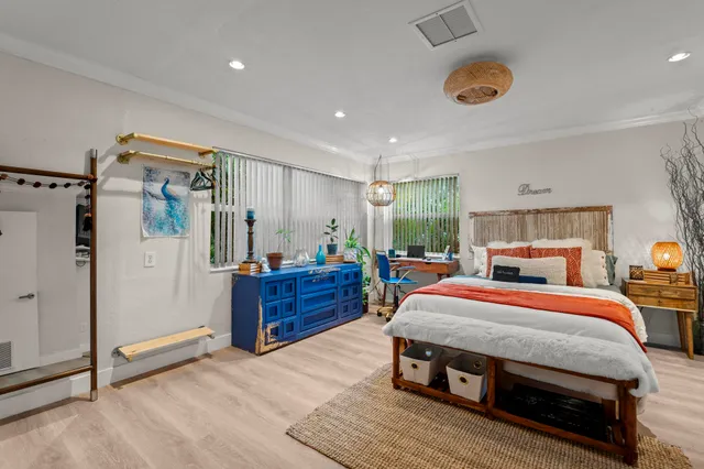 a bed room with a bed and a dresser