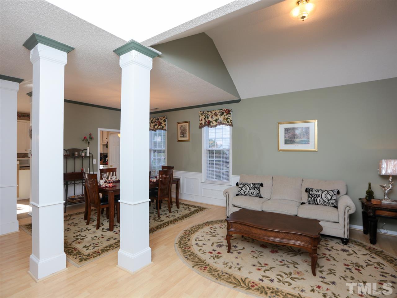4604 Drewbridge Way Raleigh, NC 27604 - Photo 2 of 24 a living room with furniture and a dining table