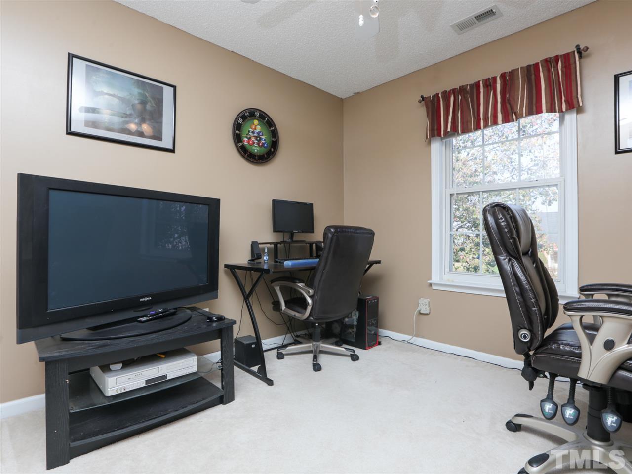 4604 Drewbridge Way Raleigh, NC 27604 - Photo 19 of 24 a view of a workspace with furniture and a window