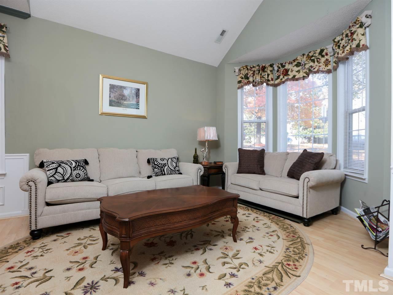 4604 Drewbridge Way Raleigh, NC 27604 - Photo 3 of 24 a living room with furniture and a large window
