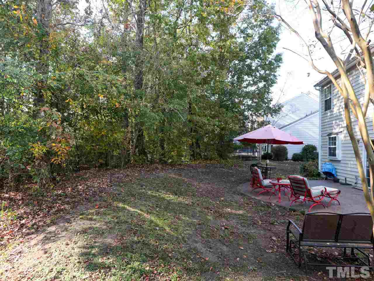 4604 Drewbridge Way Raleigh, NC 27604 - Photo 24 of 24 a view of a patio with a table and chairs under an umbrella