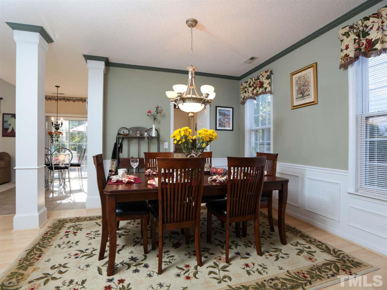 4604 Drewbridge Way Raleigh, NC 27604 - Photo 4 of 24 a view of a dining room with furniture window and wooden floor