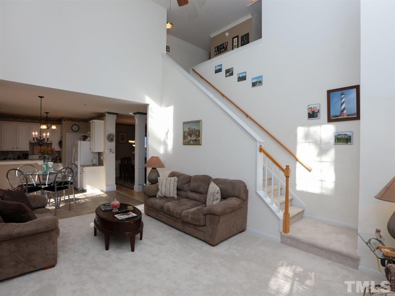 4604 Drewbridge Way Raleigh, NC 27604 - Photo 9 of 24 a living room with furniture and a ceiling fan