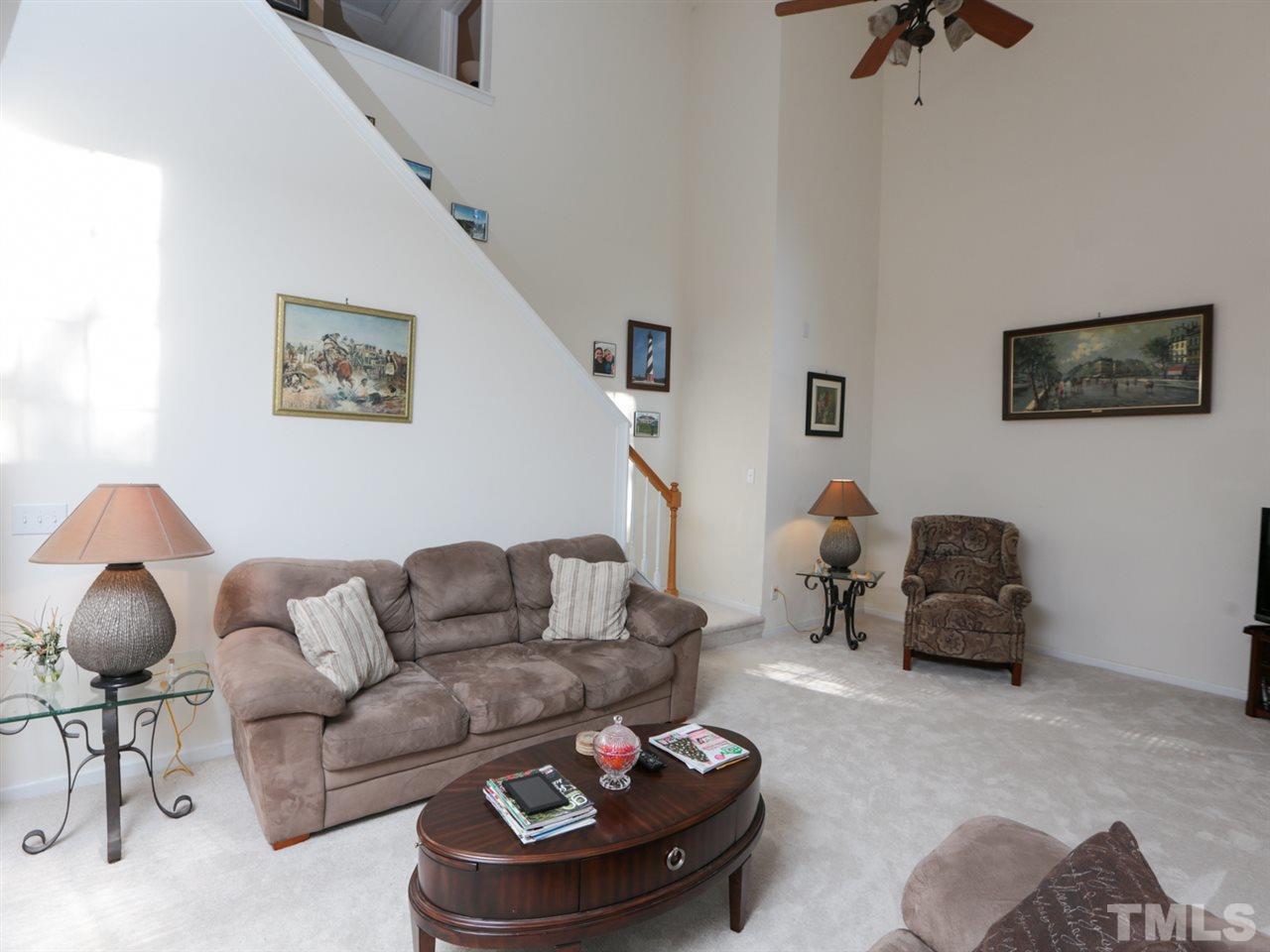 4604 Drewbridge Way Raleigh, NC 27604 - Photo 10 of 24 a living room with furniture and a mirror