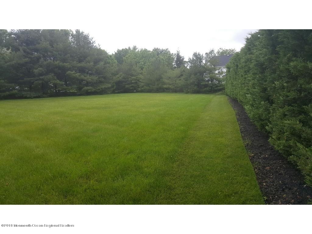 146 Howell Road Freehold, NJ 07728 - Photo 1 of 4 a open area with trees in the background