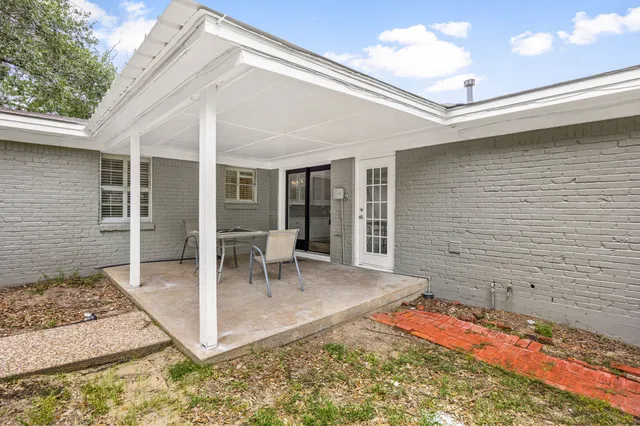 a view of a swimming pool with a yard