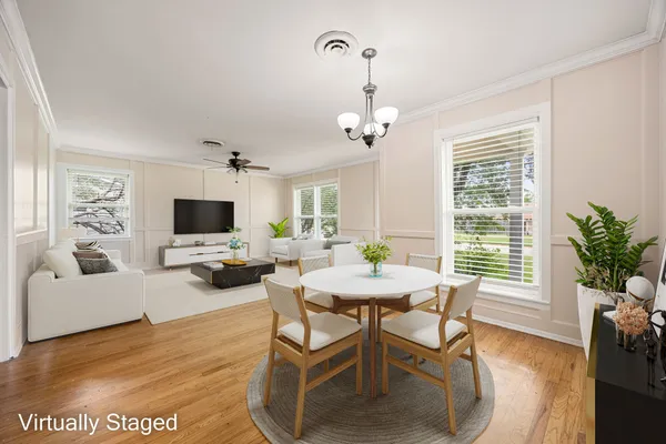 a view of a livingroom with furniture and a flat screen tv