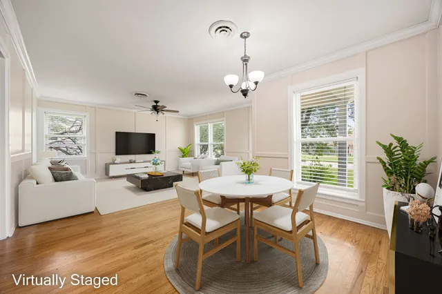 a view of a livingroom with furniture and a flat screen tv