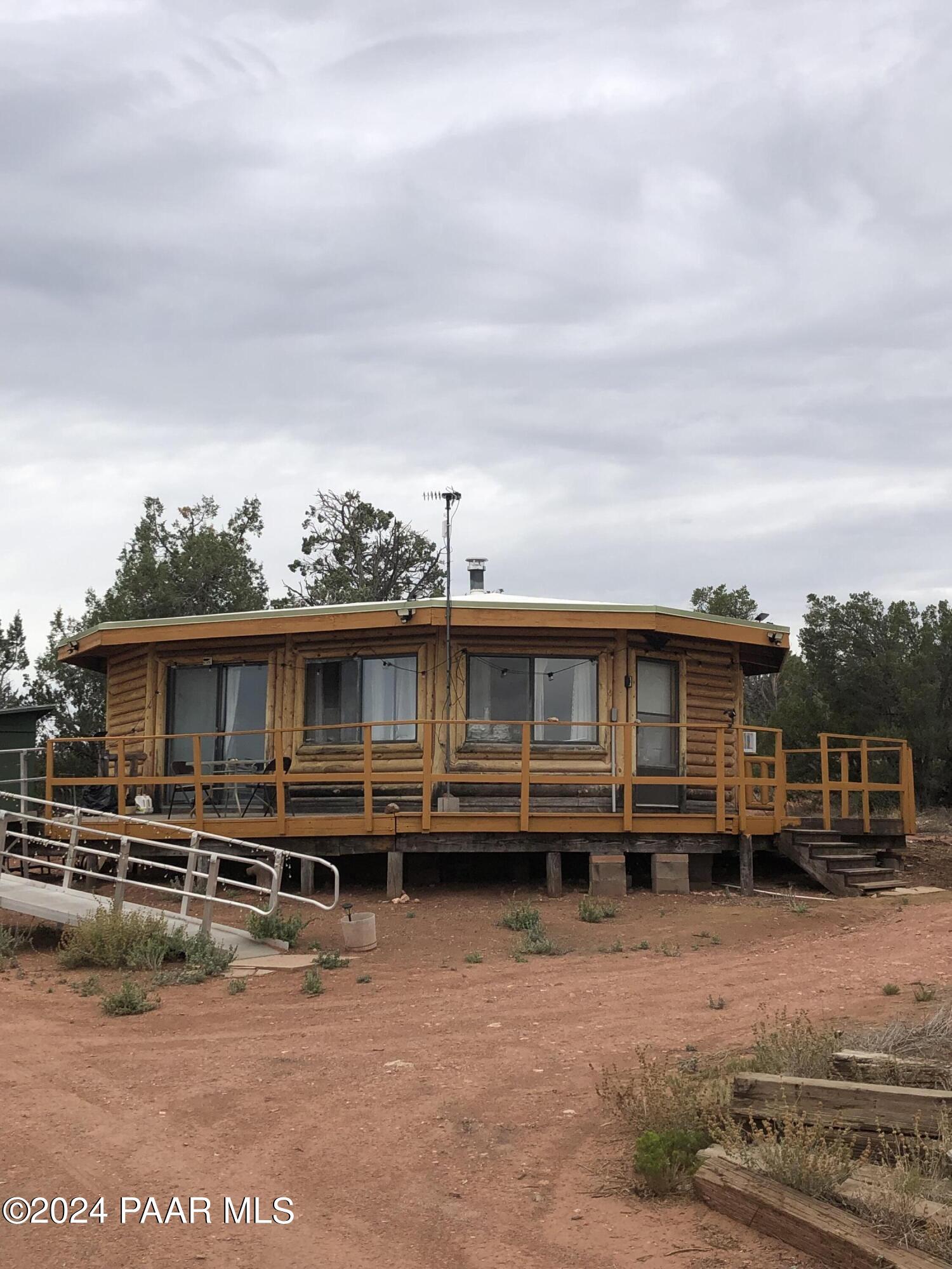 56539 El Parque Circle Seligman, AZ 86337 - Photo 17 of 37 a view of a house with wooden deck
