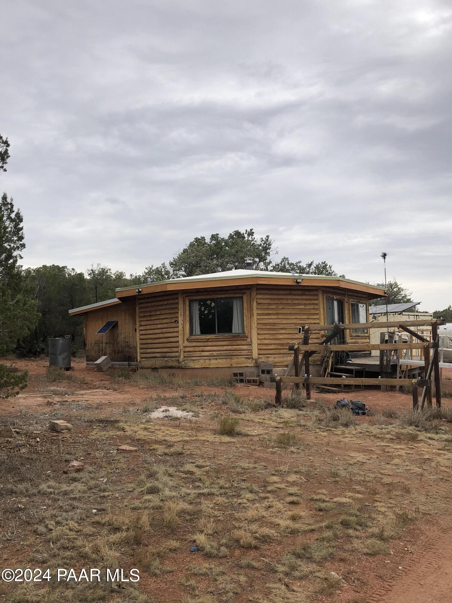 56539 El Parque Circle Seligman, AZ 86337 - Photo 22 of 37 a backyard of a house with table and chairs