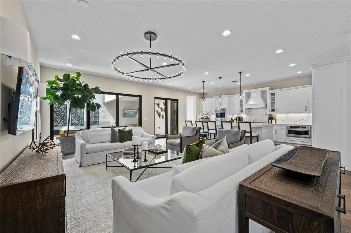 13237 Alton Road Palm Beach Gardens, FL 33418 - Photo 11 of 51 a living room with furniture kitchen view and a large window