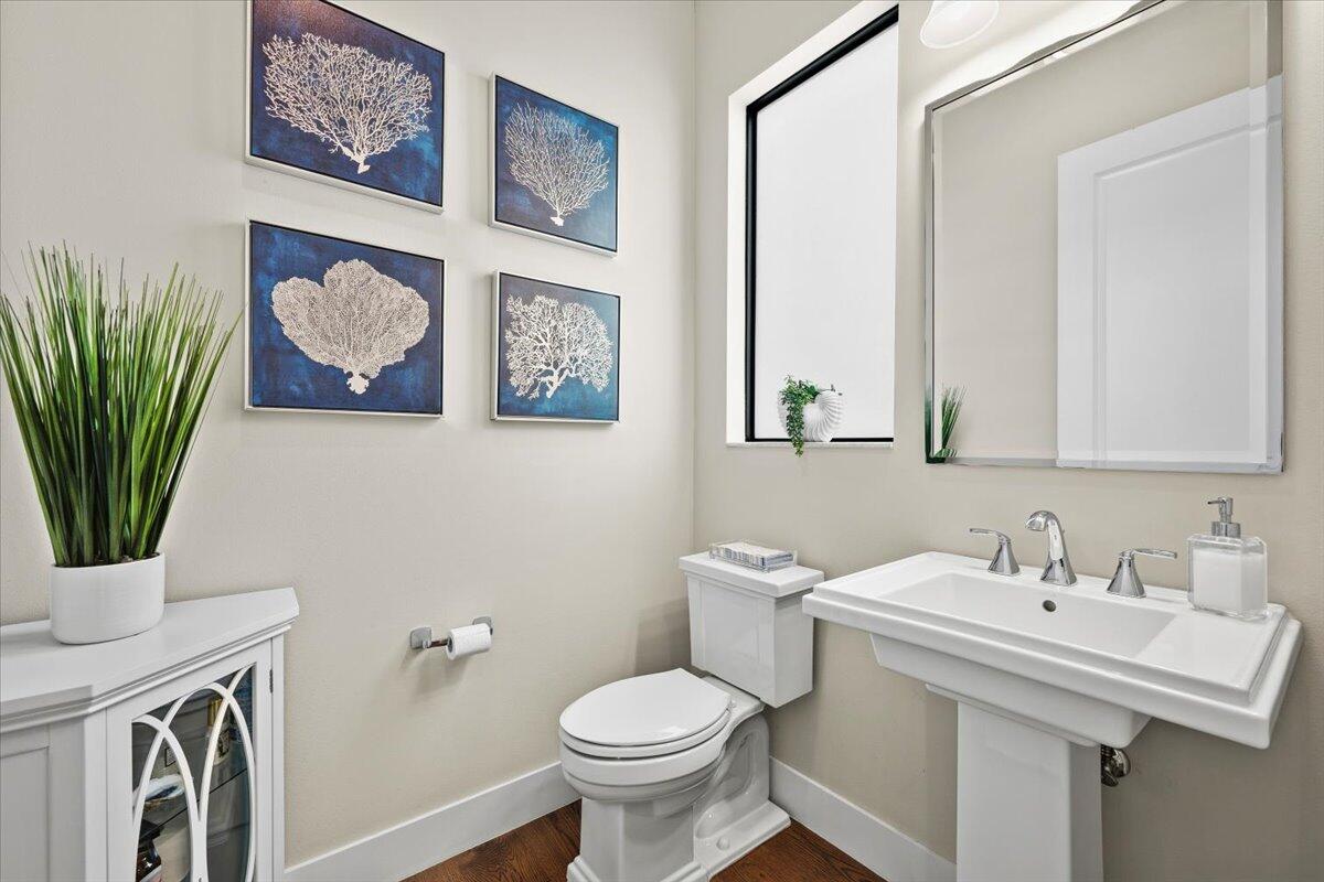 13237 Alton Road Palm Beach Gardens, FL 33418 - Photo 14 of 51 a bathroom with a sink a toilet and a mirror