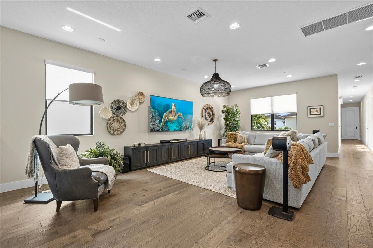 13237 Alton Road Palm Beach Gardens, FL 33418 - Photo 15 of 51 a living room with furniture and a large window