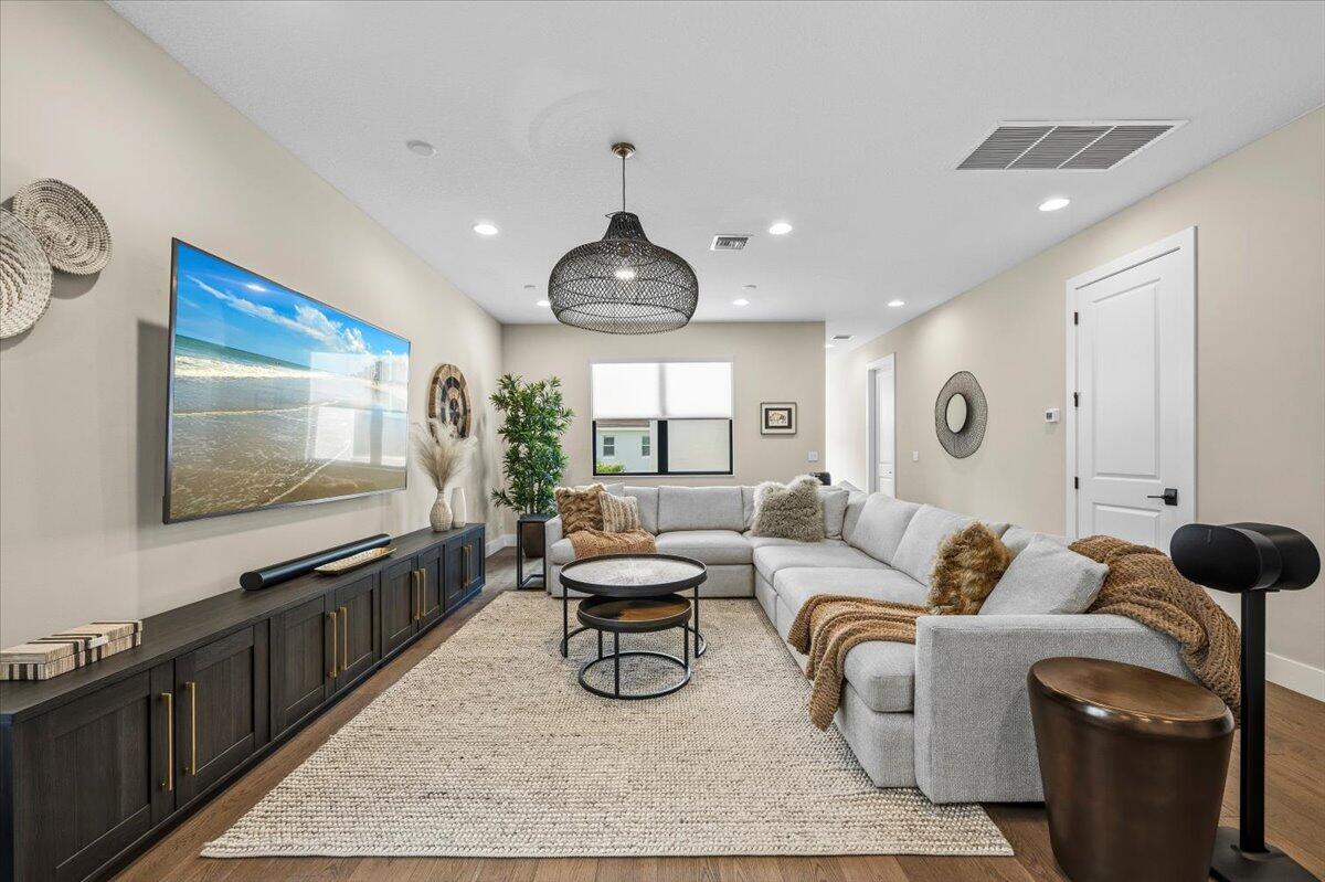 13237 Alton Road Palm Beach Gardens, FL 33418 - Photo 16 of 51 a living room with furniture and a flat screen tv