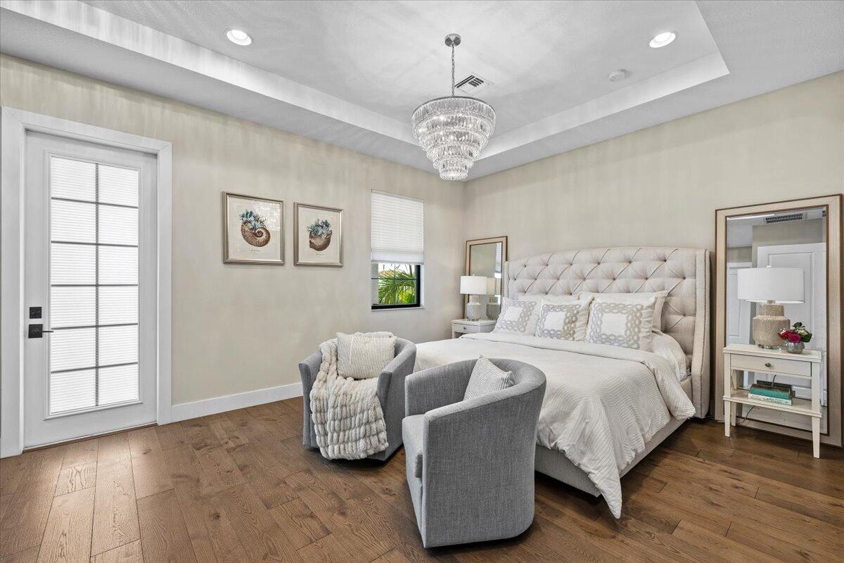13237 Alton Road Palm Beach Gardens, FL 33418 - Photo 17 of 51 a bedroom with bed and a window