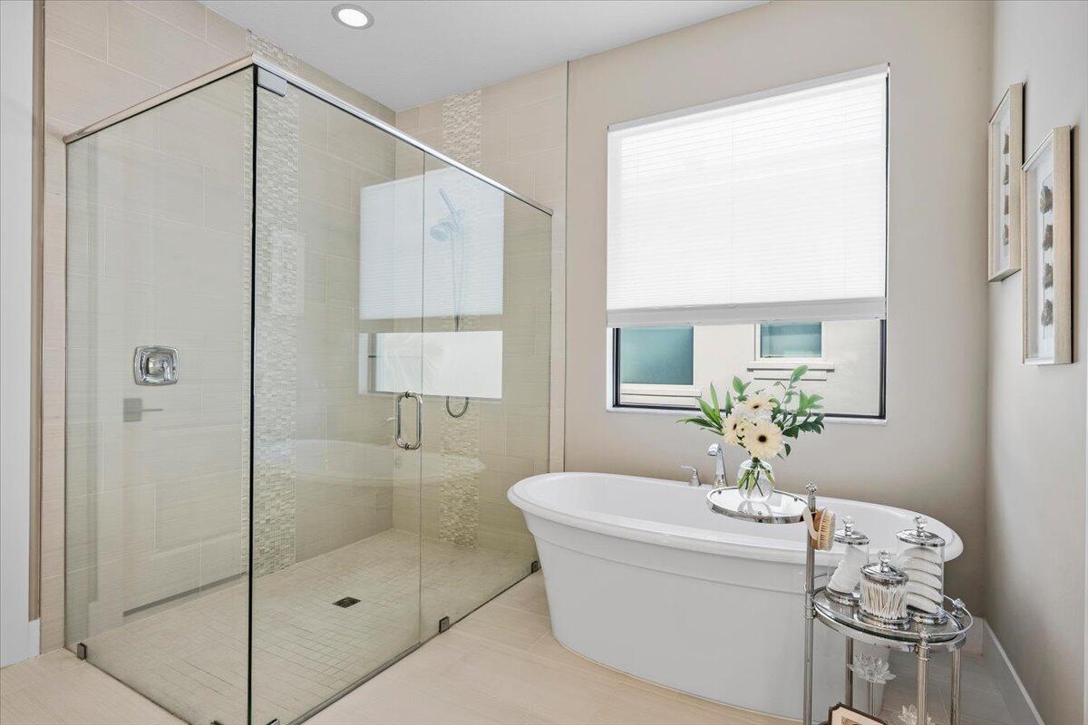 13237 Alton Road Palm Beach Gardens, FL 33418 - Photo 21 of 51 a bathroom with a shower a mirror and a sink