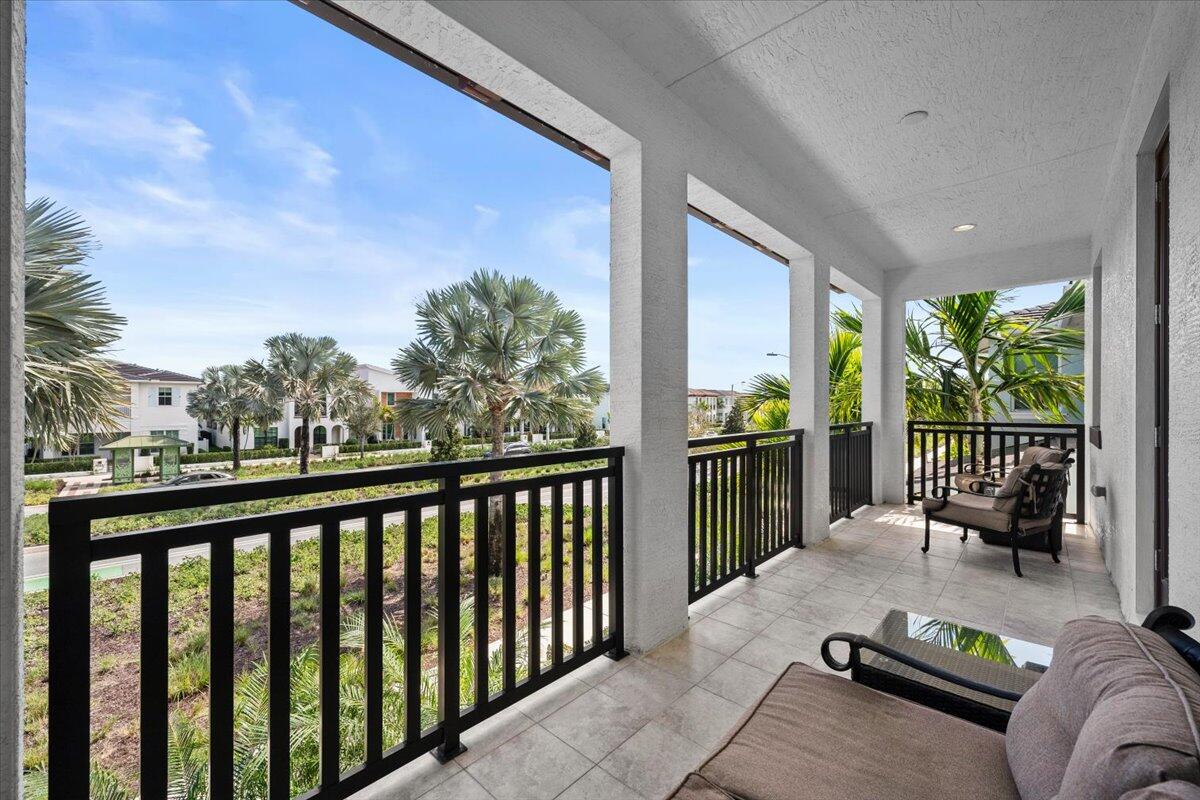 13237 Alton Road Palm Beach Gardens, FL 33418 - Photo 22 of 51 a balcony with furniture and city view